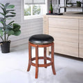 Tabouret de bar pivotant noir hauteur comptoir, similicuir, garniture cloutée
